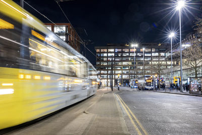 Uk, england, manchester, long exposure of passing cable car at night