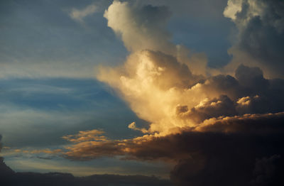 Low angle view of clouds in sky during sunset