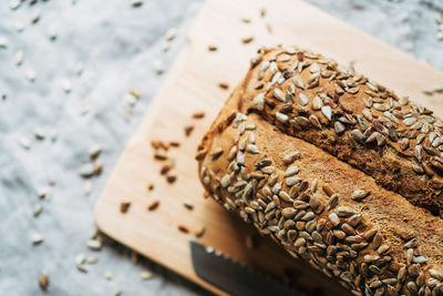 Close-up of bread on cutting board at table