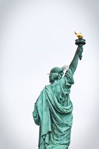 Low angle view of statue against sky