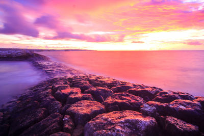 Scenic view of sea against sky during sunset