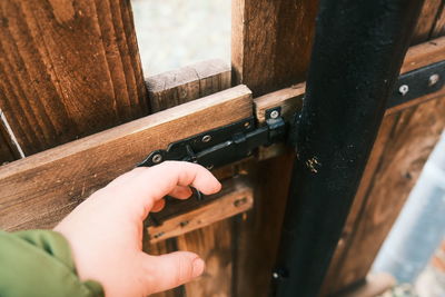 Close-up of hand holding metal