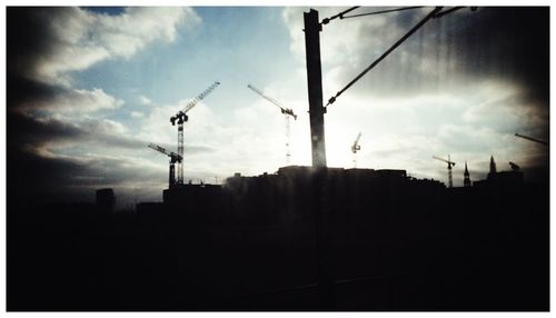 Low angle view of built structure against cloudy sky