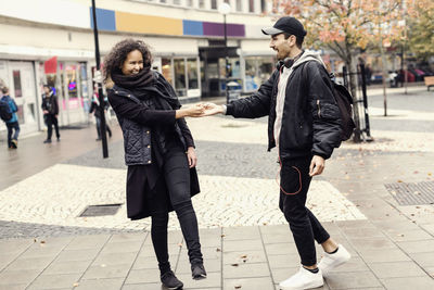 Happy couple enjoying on city street