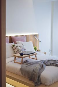 Cat relaxing on bed at home