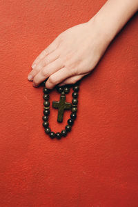 Close-up of woman hand with red tattoo