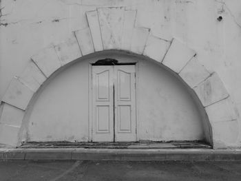 Low angle view of window in abandoned building