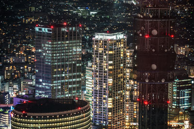 Illuminated buildings in city at night