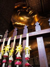 Statue of buddha in city at night