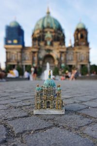 View of temple against building in city