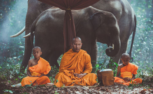 Group of people sitting in temple