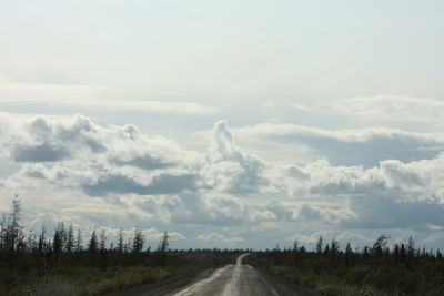 Road amidst landscape against sky