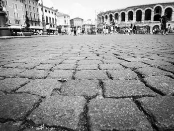 View of cobblestone street in city