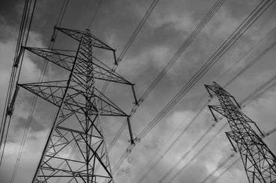 Low angle view of electricity pylon against sky