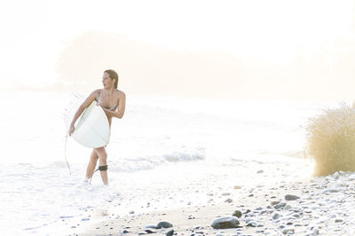 Full length of man walking on beach