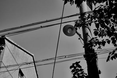 Low angle view of street light against sky