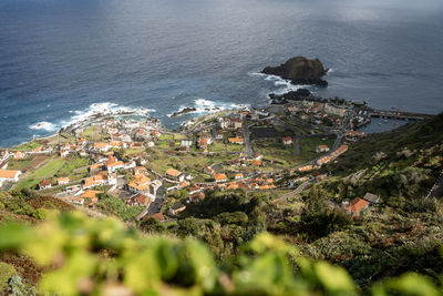 High angle view of townscape by sea