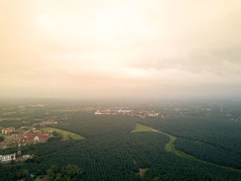 High angle view of townscape on field against sky