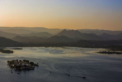 Scenic view of mountain range at sunset