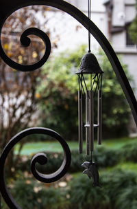 Close-up of electric lamp hanging on metal