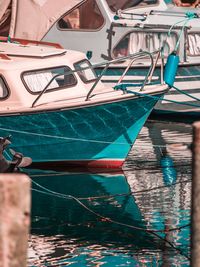 Fishing boats moored at harbor