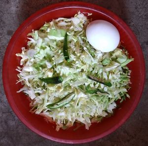 High angle view of chopped vegetables in bowl on table