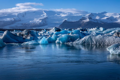 Scenic view of snowcapped mountains against sky