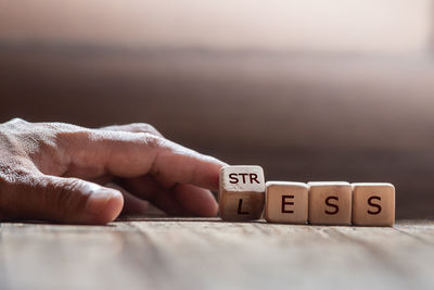 Close-up of hand holding text