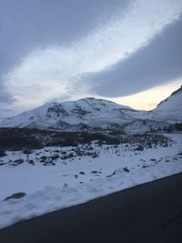 Scenic view of snow covered mountains against sky