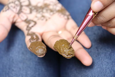 Close-up of woman holding hands