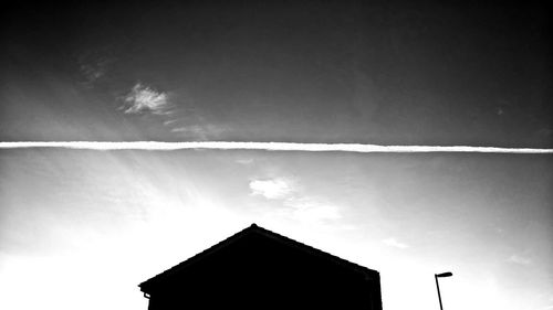 Low angle view of vapor trail against sky