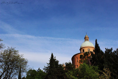 Low angle view of church against blue sky