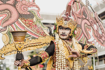 Statue of buddha against building