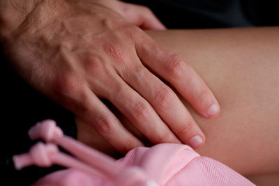 Close-up of hand holding hands