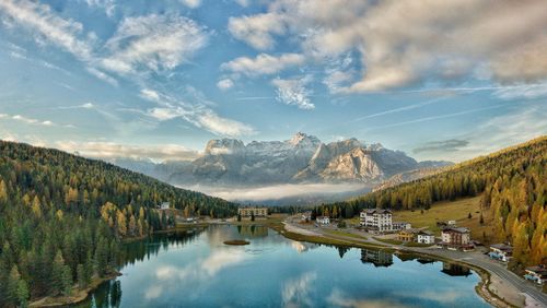 Scenic view of lake and mountains against sky