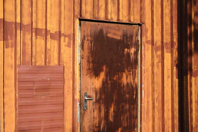 Closed wooden door of house