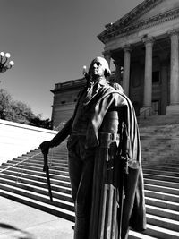 Low angle view of statue against building