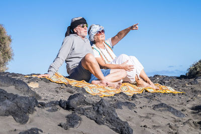 Senior couple relaxing at beach