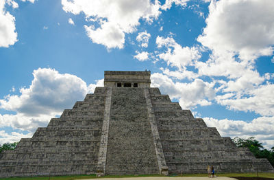 Low angle view of historical building against cloudy sky