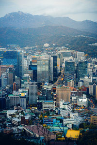 High angle view of buildings in city against sky