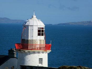 View of lighthouse against blue sky