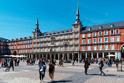 Group of people walking in building