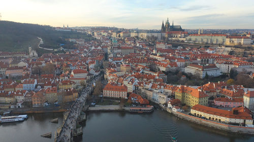 High angle view of river amidst buildings in city