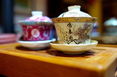 Close-up of ceramic tea cups on table