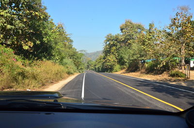 Road seen through car windshield