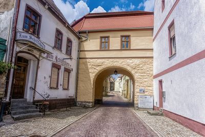 Alley amidst buildings in city