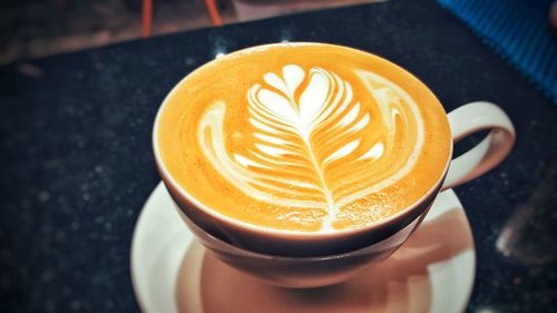 Close-up of cappuccino on table