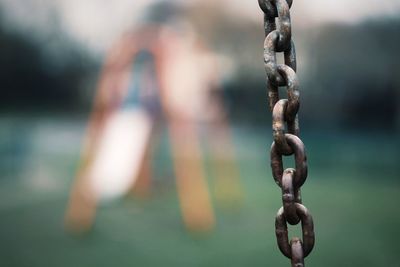 Close-up of chain hanging outdoors