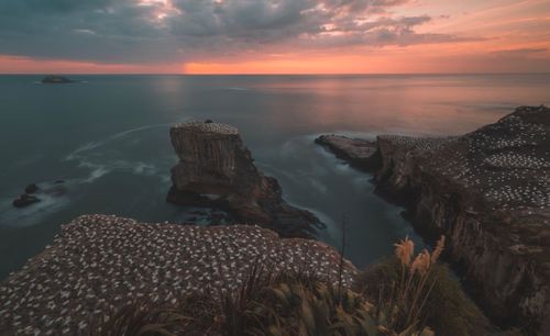 Scenic view of sea against sky at sunset