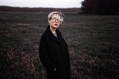 Woman standing on field